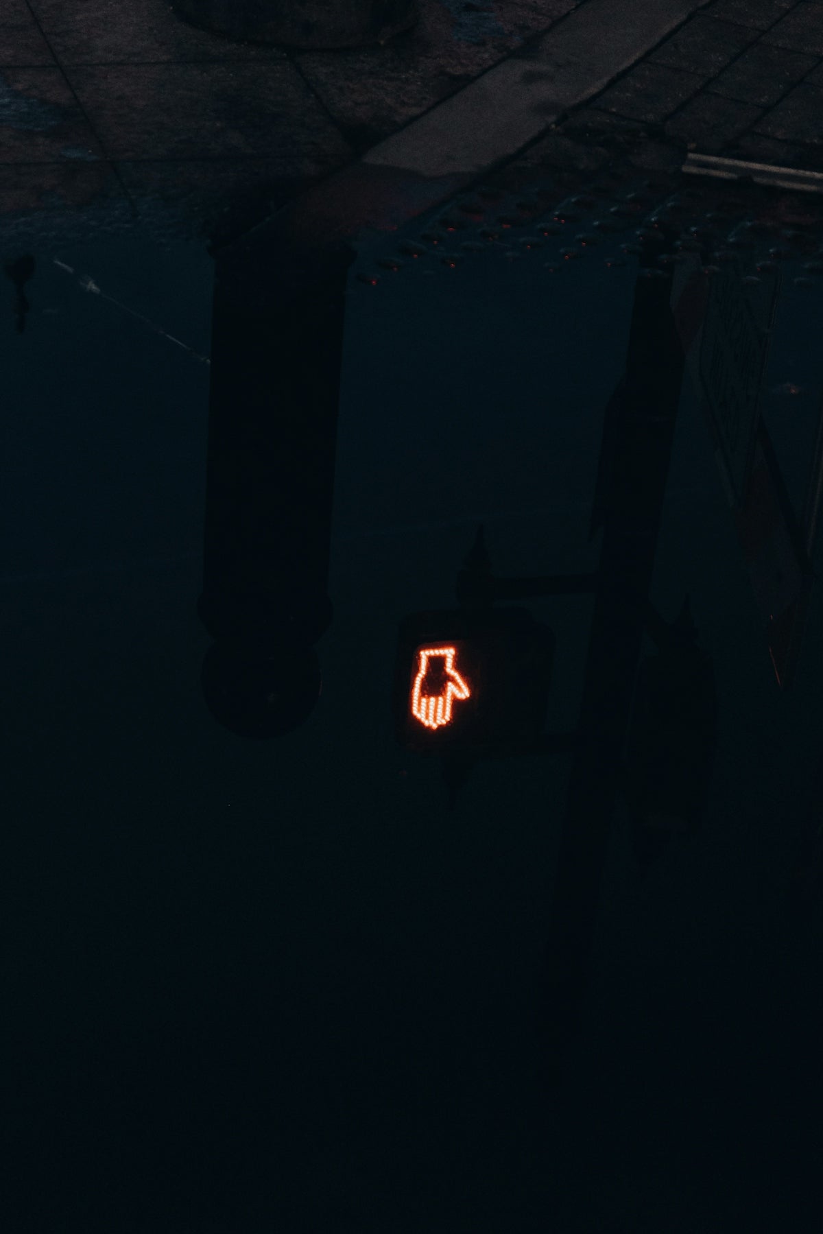 a stop sign is lit up in the dark