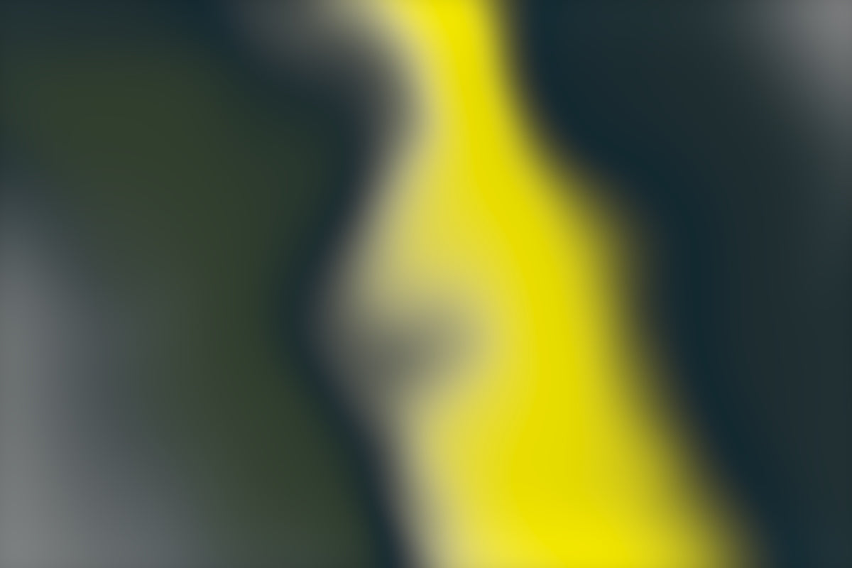 a blurry image of a yellow and black object