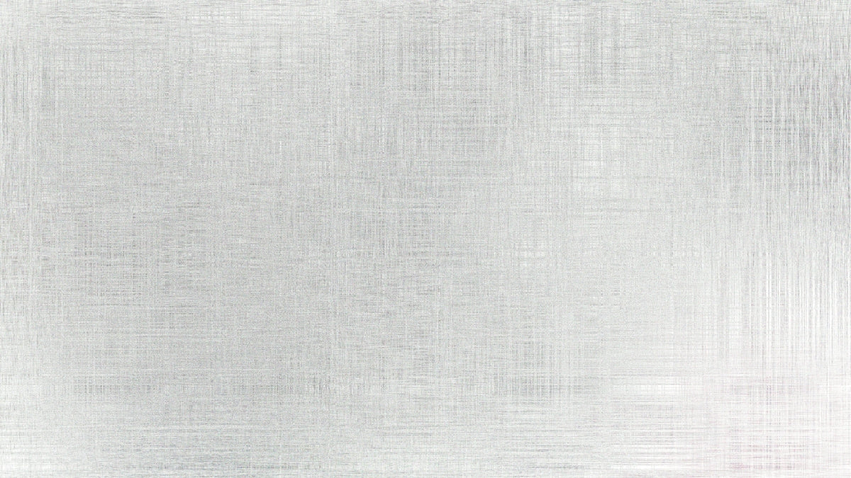 A brushed metal surface with subtle texture.